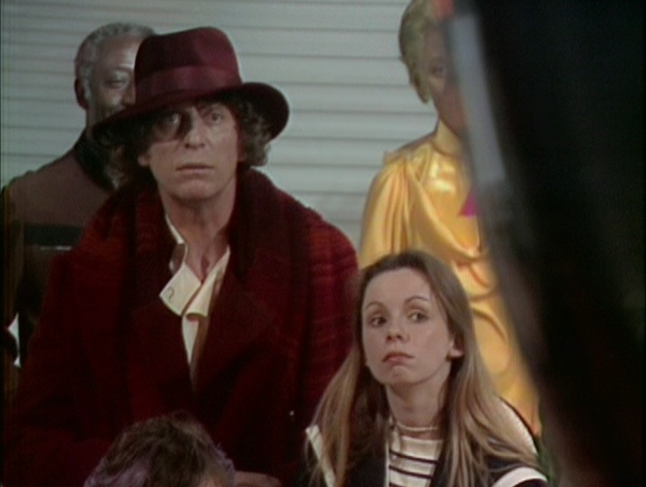 The Fourth Doctor and Romana seem unsure about this lecture on tachyonics.