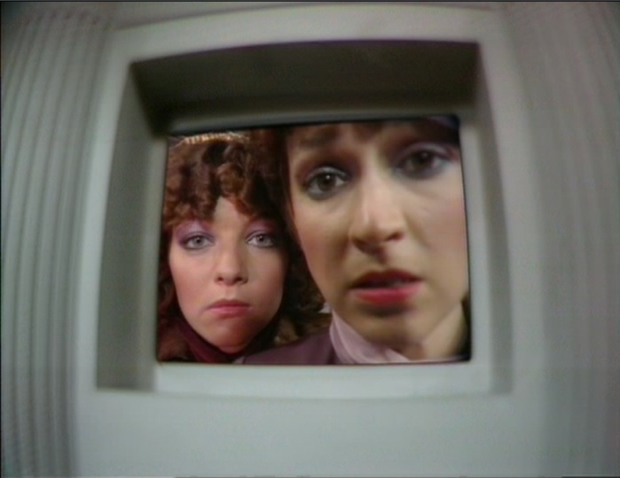 Nyssa (Sarah Sutton) and Tegan (Janet Fielding) peering into the tiny TARDIS